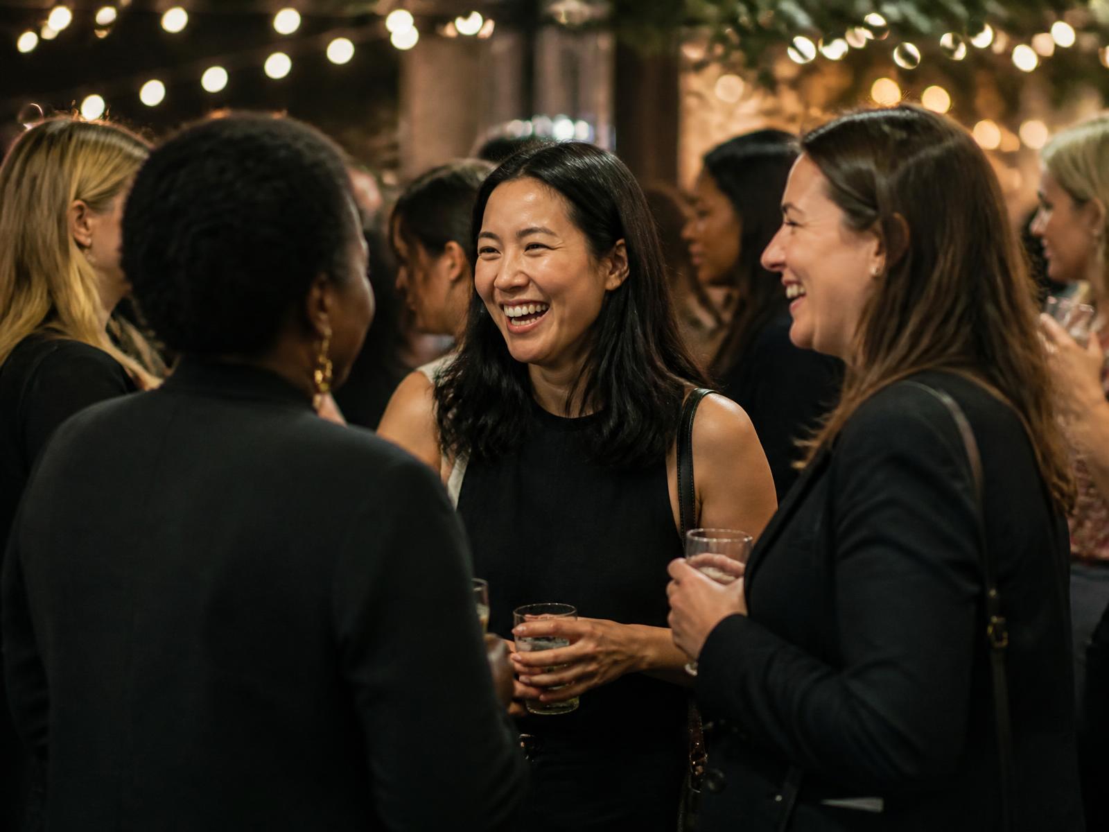 Women gathered at a Make Her Money community event